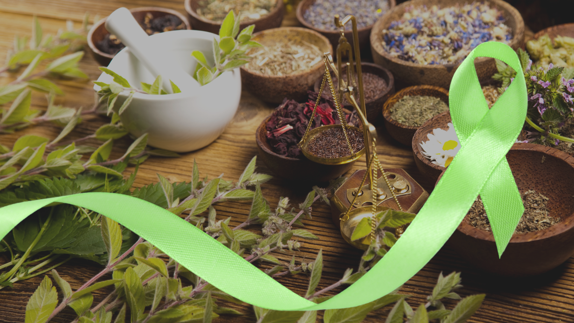 Dried herbs and a green mental health awareness ribbon