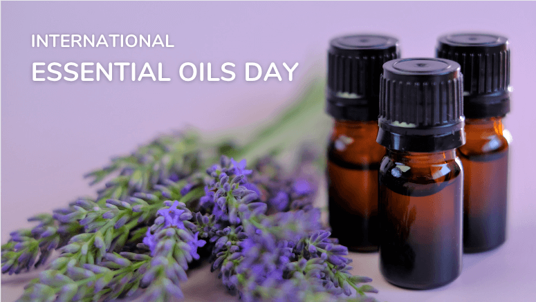 3 brown bottles of essential oils sitting next to lavender flowers on a purple background